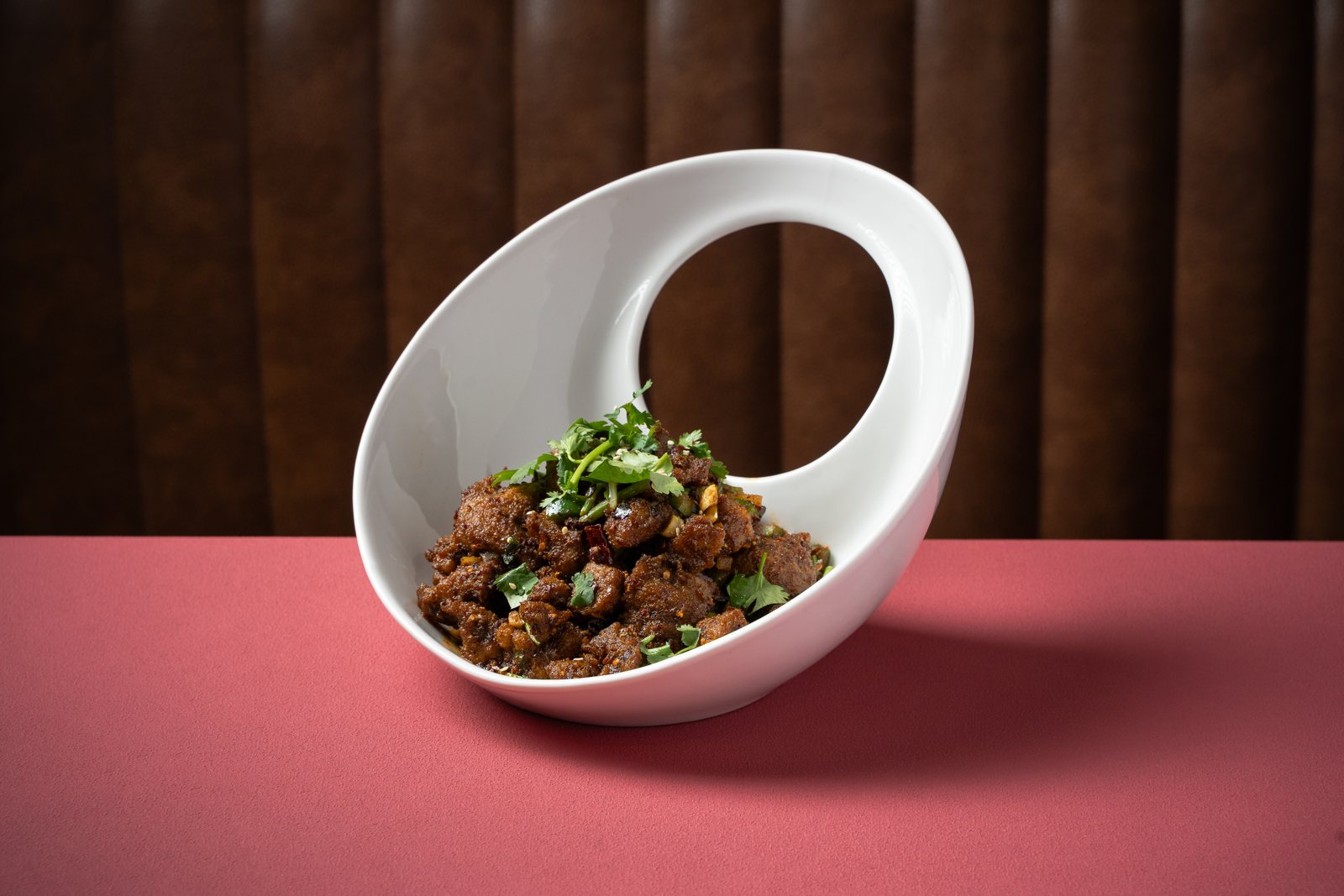 Tibetan Lamb Diced in a curved white bowl at Lao Sze Chuan Baltimore
