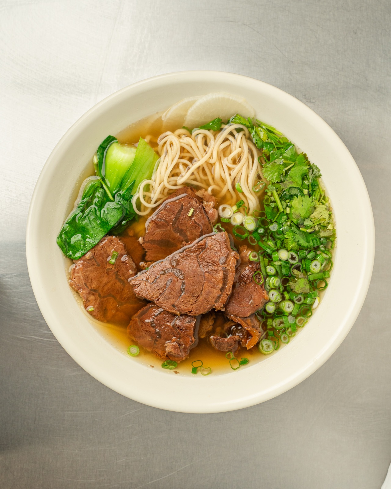 Wasai's Beef Pull Noodle Soup with beef, bok choy and scallion over hand-pulled noodles